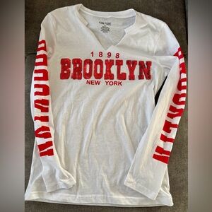 On Fire “Brooklyn” long sleeve white shirt with red letters.